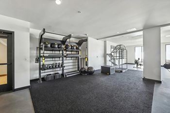 Fitness center with weight lifting equipments at Bayview Apartments, Emeryville, CA, 94608
