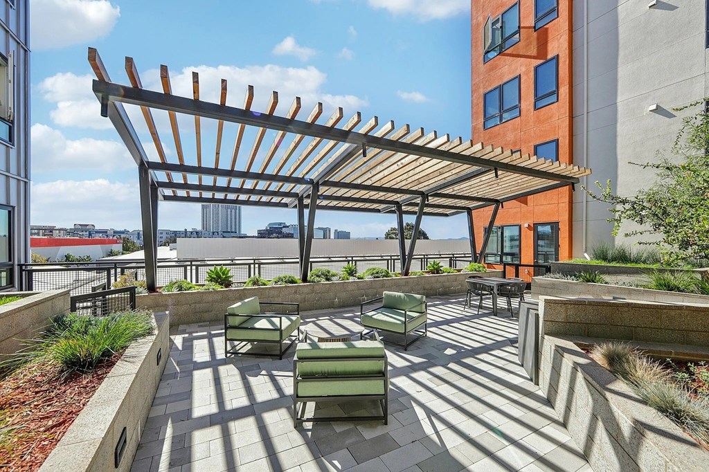 Rooftop patio with comfortable chairs at Bayview Apartments, Emeryville, CA, 94608