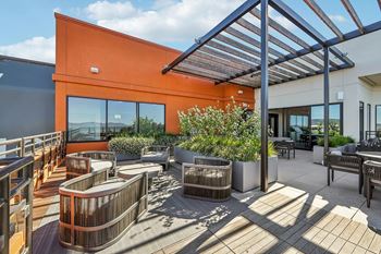 Rooftop patio with sunlight at Bayview Apartments, Emeryville