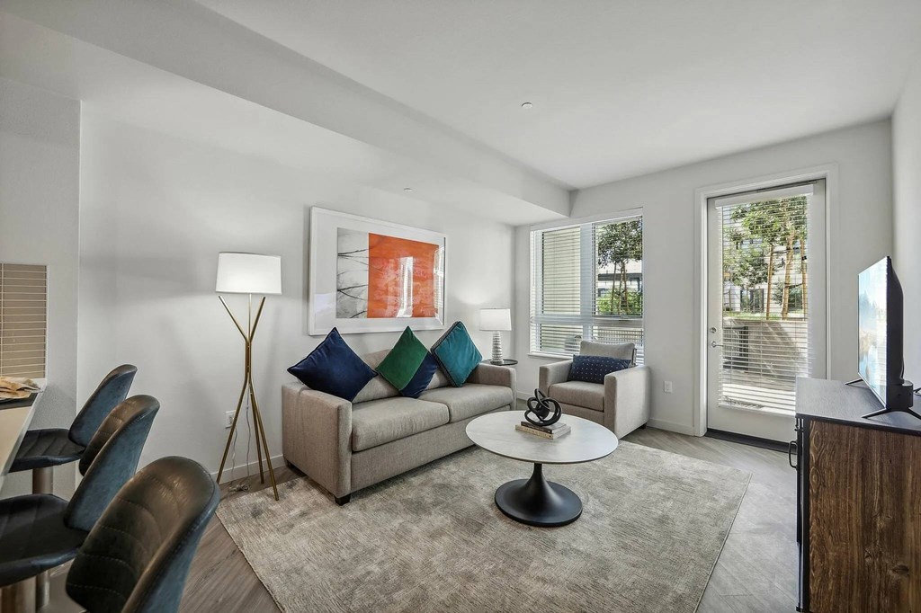 Living room with TV at Bayview Apartments, Emeryville, CA