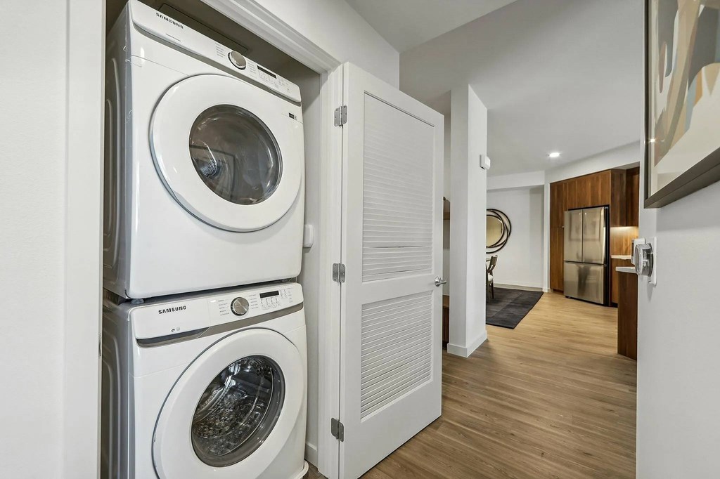 Laundry room with machines at Bayview Apartments, California, 94608