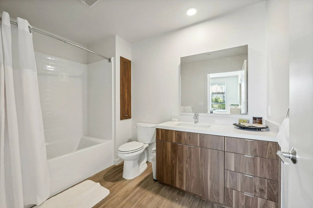 Bathroom with sink and mirror at Bayview Apartments, Emeryville, CA, 94608