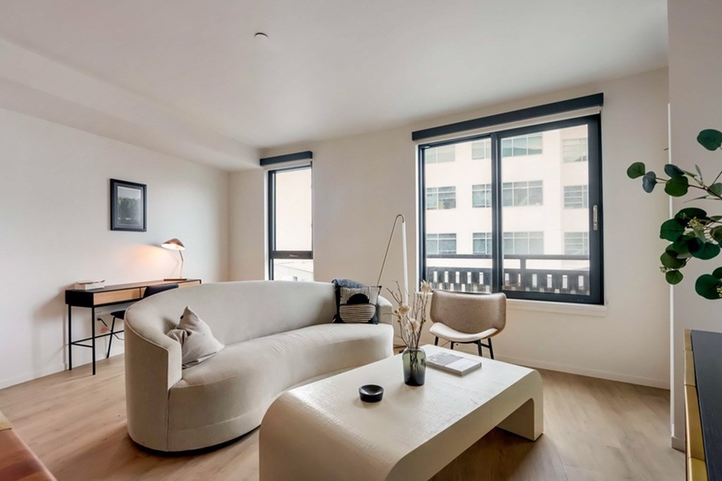 A living room with a white couch and a coffee table.at Channel House, Oakland