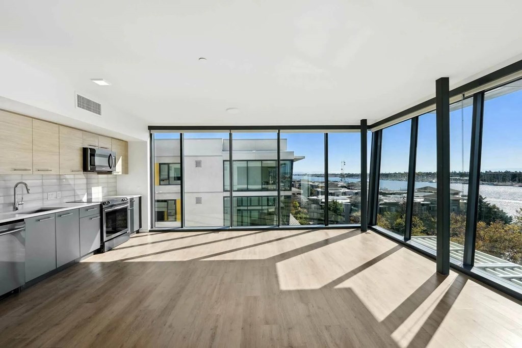 A modern kitchen with wooden floors at Channel House, California, 94607