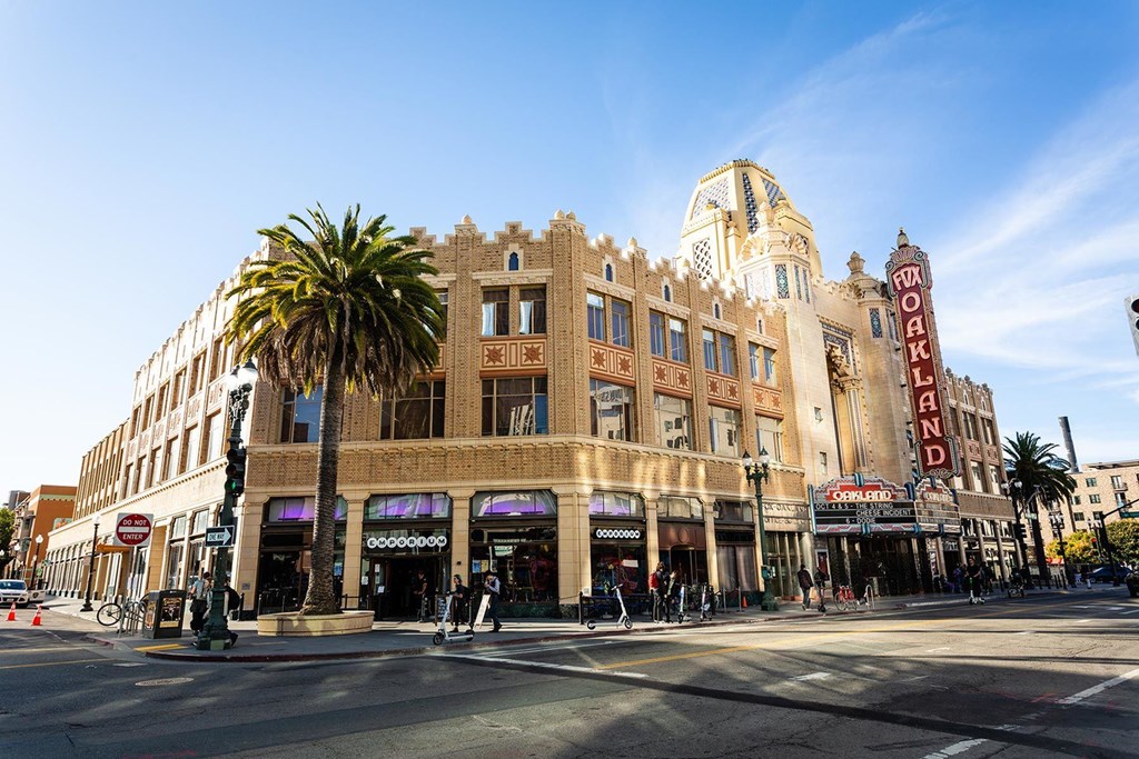 A street view of a building with a palm tree in front of it.at Channel House, California, 94607