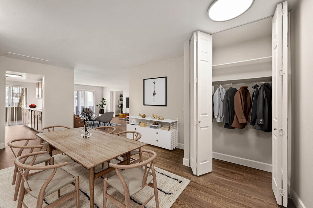 A room with a table and chairs and a wardrobe. at The Lex At Lowry, Denver, CO, 80224