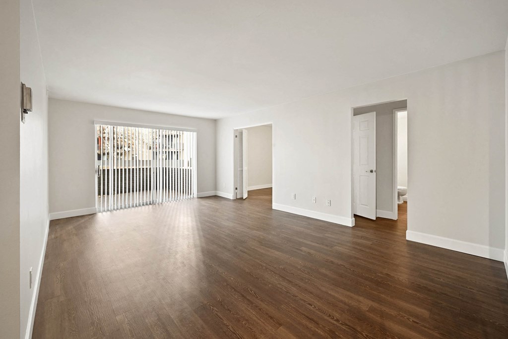 A room with wooden floors and white walls. at The Lex At Lowry, Colorado, 80224