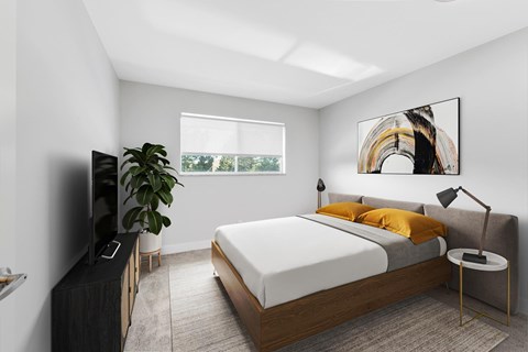 A modern bedroom with a large bed and a flat screen TV.