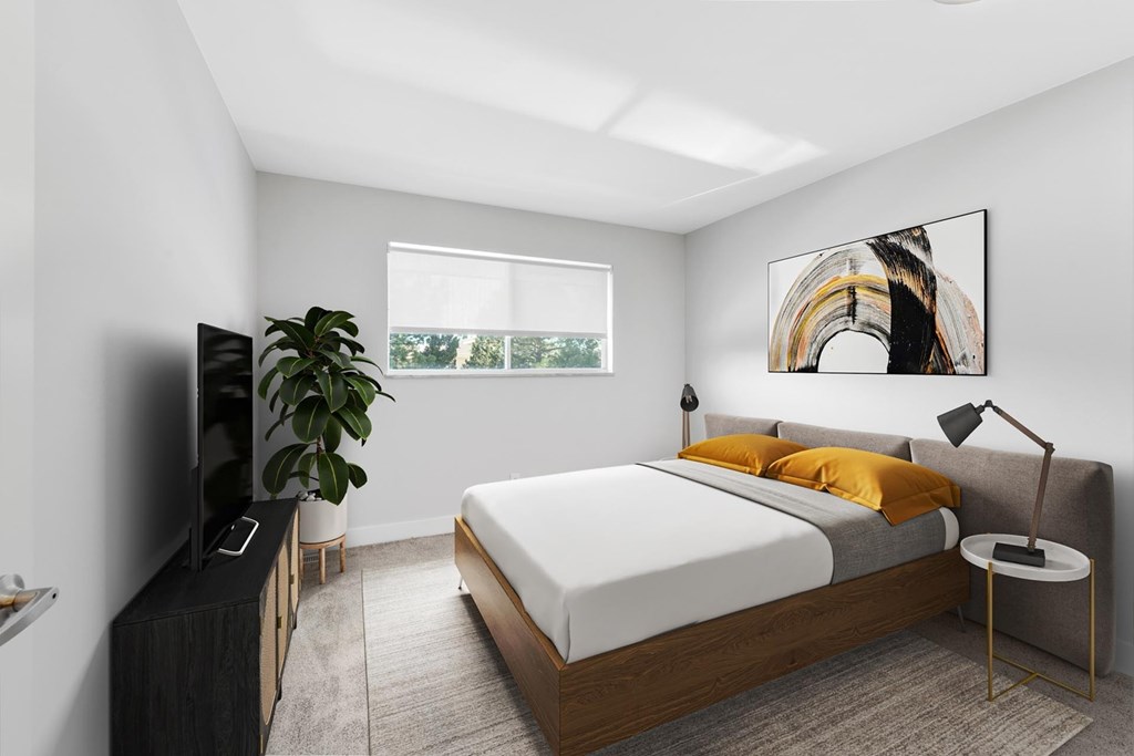 A modern bedroom with a large bed and a flat screen TV. A modern bedroom with a large bed and a flat screen TV. at The Lex At Lowry, Denver, CO, 80224