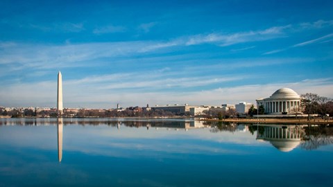 The Washington Monument and the Lincoln Memorial are reflected in the water.