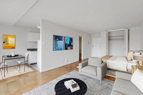 A living room with a grey couch and a coffee table.