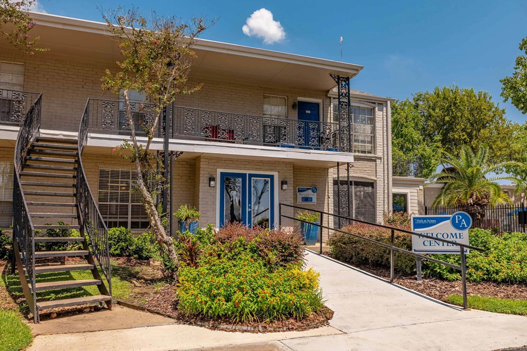A building with a blue door and a sign that says