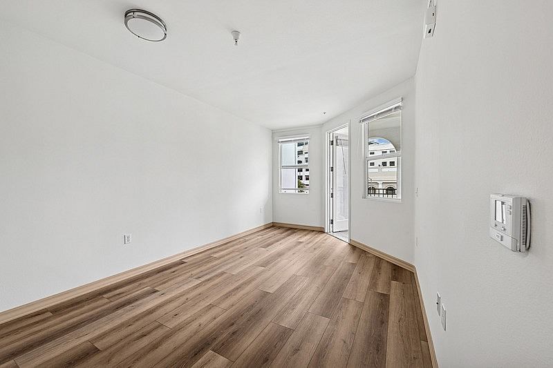 Spacious room with wooden floor at Parkview Living Apartments, Los Angeles, CA