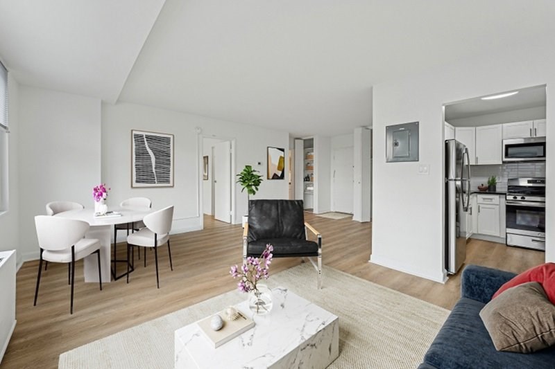 A modern living room with a dining table and chairs.at Sherwood at Southern Towers, Alexandria