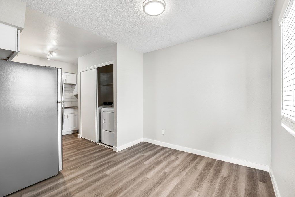 A kitchen with a refrigerator at Solara, Phoenix, 85033