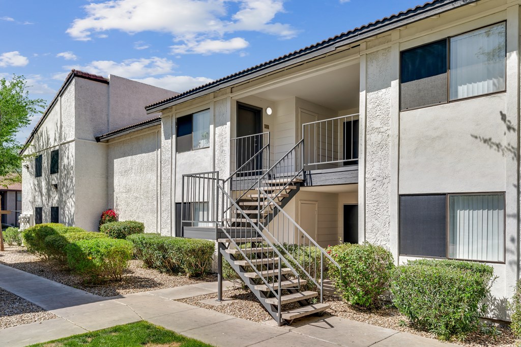 A building with a staircase leading to the entrance.at Solara, Arizona, 85033
