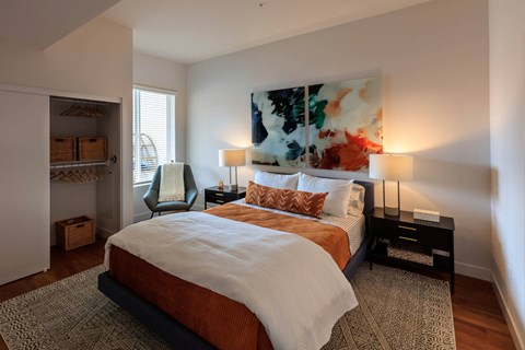 Bedroom with large bed at Sora Apartments, Inglewood, CA