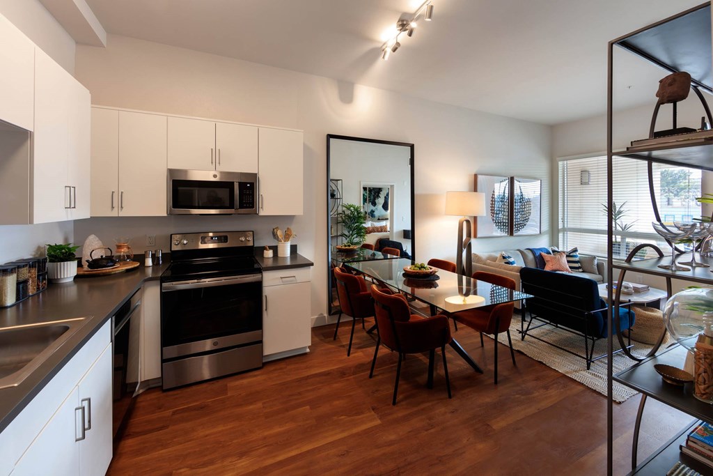 Kitchen with glass dining table at Sora Apartments, Inglewood, California