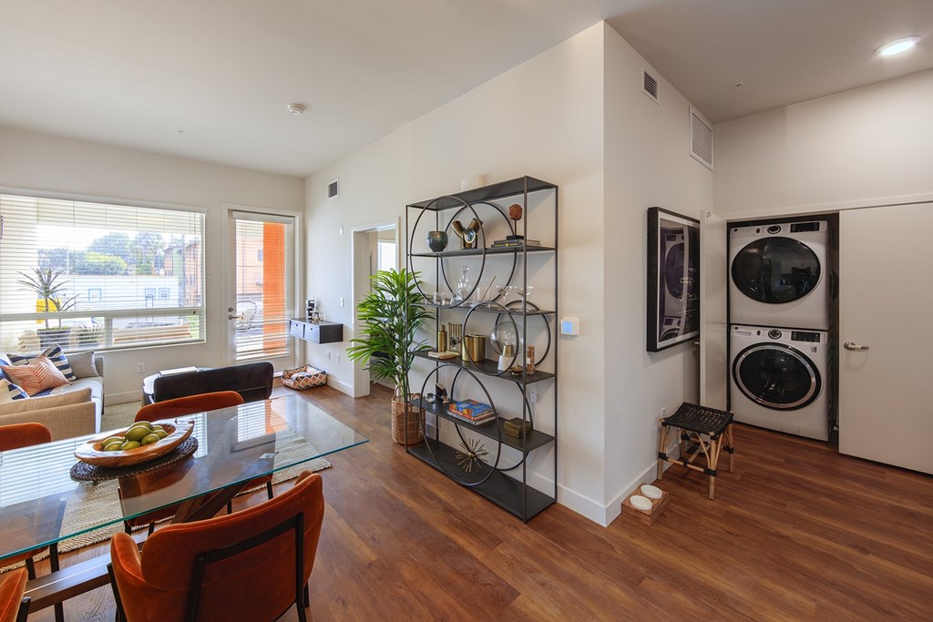 Dining table with living room view at Sora Apartments, Inglewood, 90302
