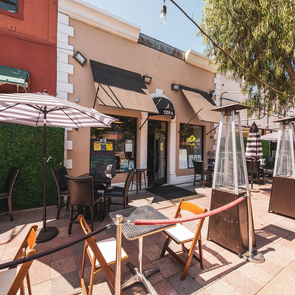 Shops with seating area outside at Sora Apartments, Inglewood, 90302