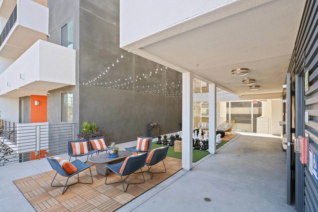 Common area with chairs and chess board at Sora Apartments, California, 90302