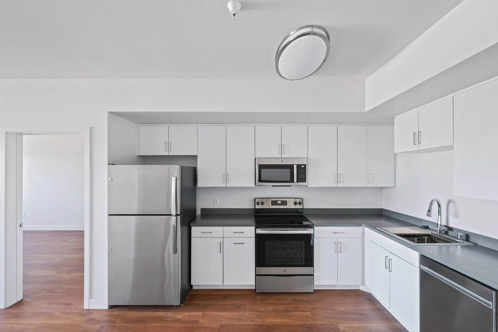 Kitchen with sink and white cabinetry at Sora Apartments, California, 90302