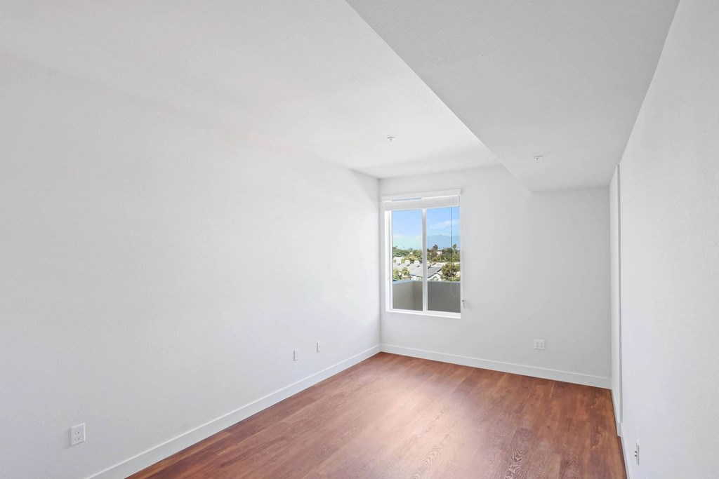 Unfurnished room with a window at Sora Apartments, California