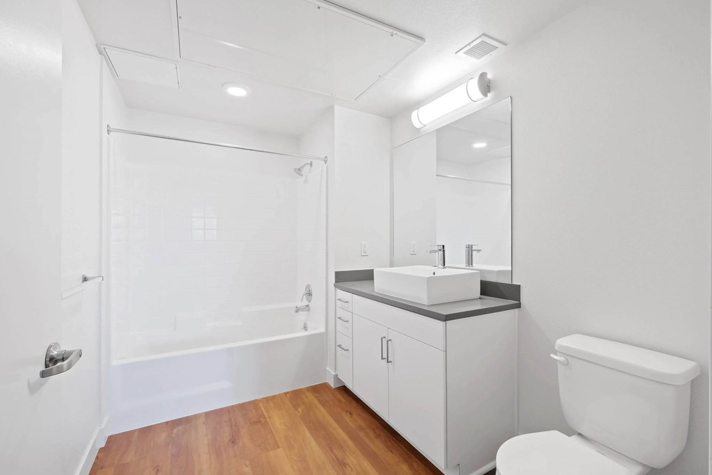 Bathroom with toilet and mirror at Sora Apartments, California, 90302