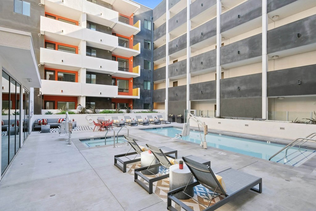 Lounge chairs near the pool at Sora Apartments, Inglewood