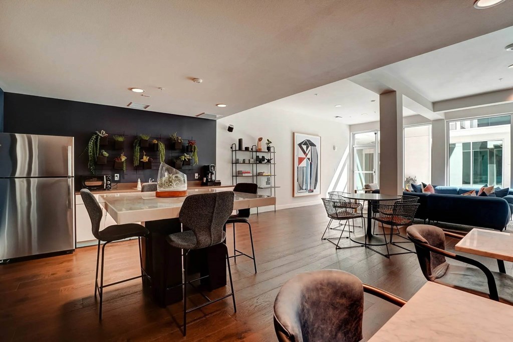 Clubhouse kitchen with refrigerator at Sora Apartments, Inglewood, California, 90302