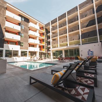 Lounge chairs with cushions at Sora Apartments, Inglewood, CA, 90302