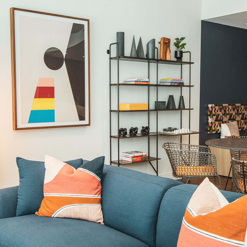 Living room with Blue couch at Sora Apartments, Inglewood, CA