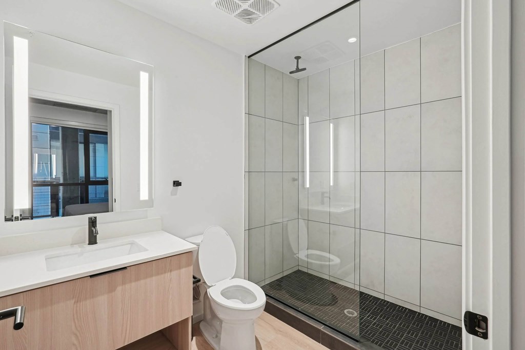Bathroom with sink and mirror at Velaris Living Apartments, Denver