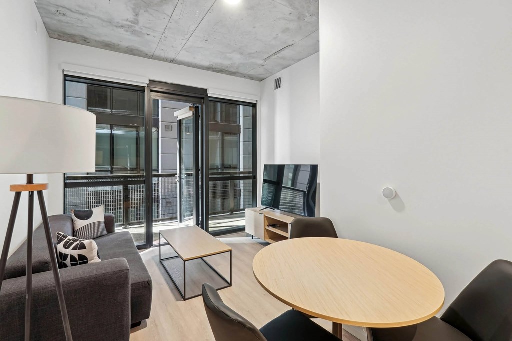 Living room with couch and TV at Velaris Living Apartments, Colorado, 80205