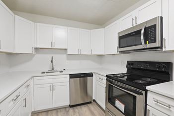 Kitchen with white cabinetry at Vistas of Annandale, Annandale, Virginia