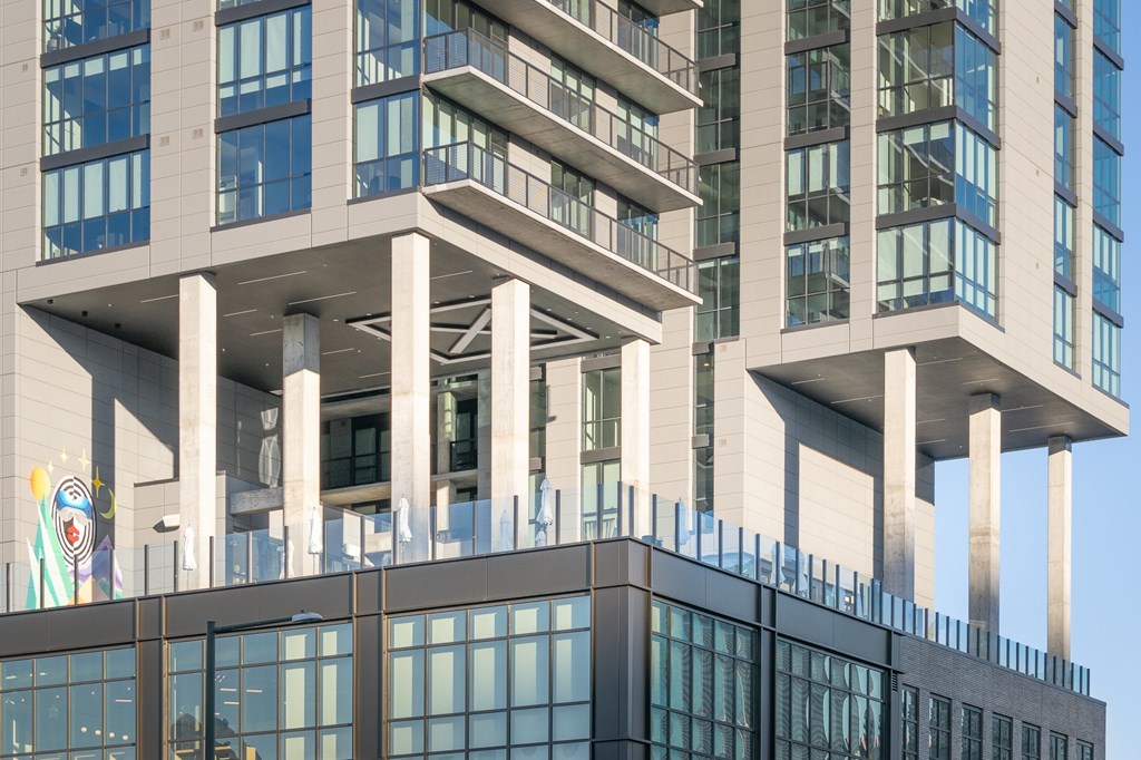 Modern building with a glass facade at Velaris Living Apartments, Denver, Colorado