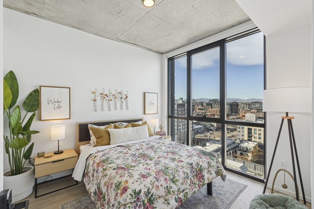 Bedroom with a large bed at Velaris Living Apartments, Denver, Colorado