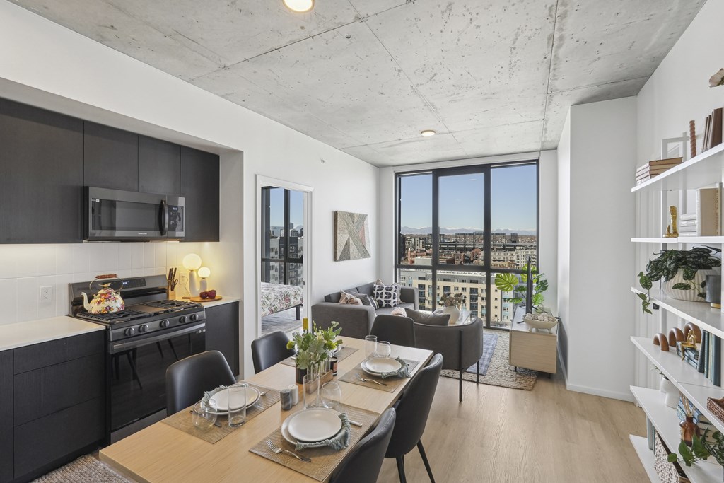 Living room with oversized windows at Velaris Living Apartments, Colorado