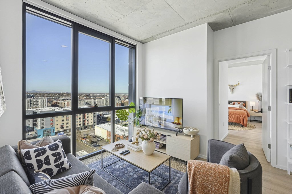 Living room with TV at Velaris Living Apartments, Denver