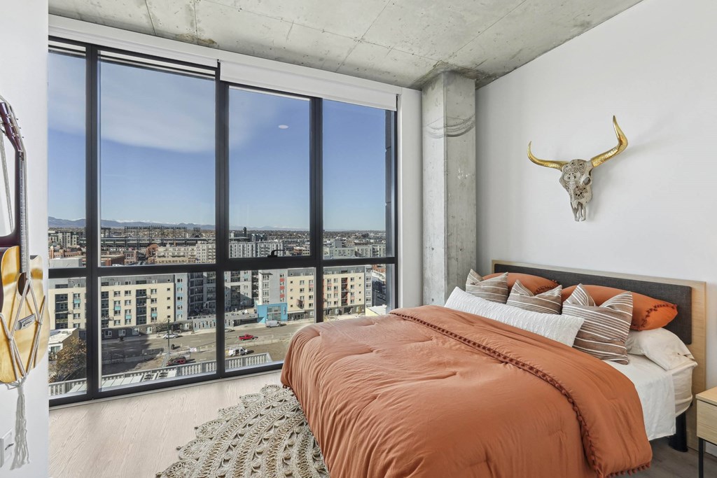 Bedroom with cozy bed at Velaris Living Apartments, Denver