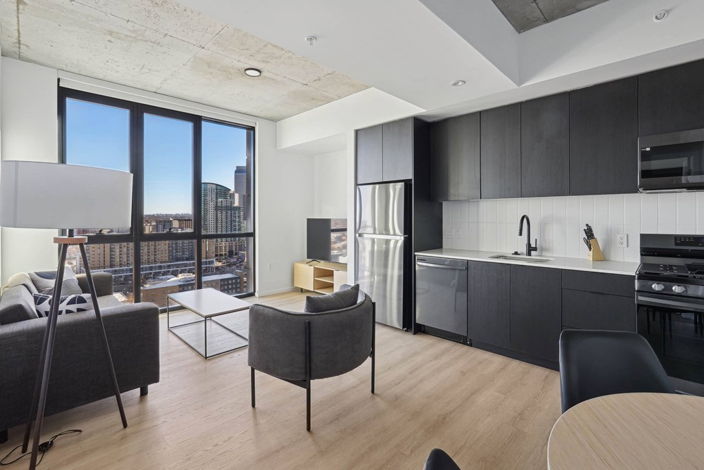 Kitchen with black cabinets at Velaris Living Apartments, Denver, CO