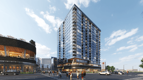 A modern building with a glass facade is the focal point of a bustling city street at The Mitchell in Downtown Atlanta