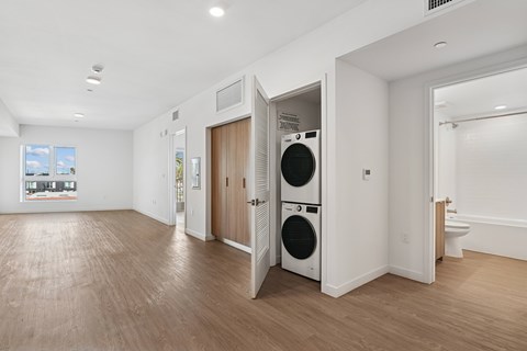 A laundry room with a washer and dryer in it.