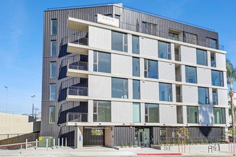 A modern building with a black and white facade and a red awning at the entrance at 1915 Park, Los Angeles, CA 90026