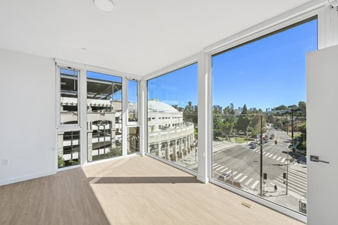 A room with a view of a street through large windows at 1915 Park, Los Angeles, CA 90026