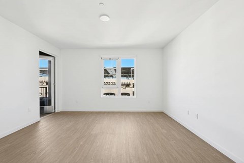 A large empty room with a window and a door at 1915 Park, Los Angeles, CA 90026