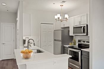 Kitchen with white cabinets at Cambridge Apartments, Raleigh, 7615