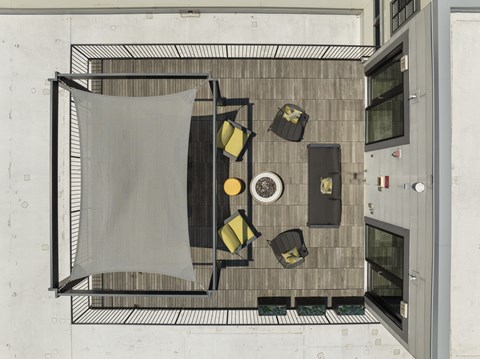 A top view of a dining area with a table, chairs, and a hanging cloth, 28 Austin, Newton, Massachusetts