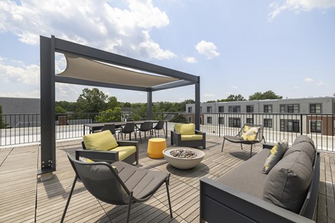 A patio with a table and chairs under a canopy, 28 Austin, Newton, Massachusetts