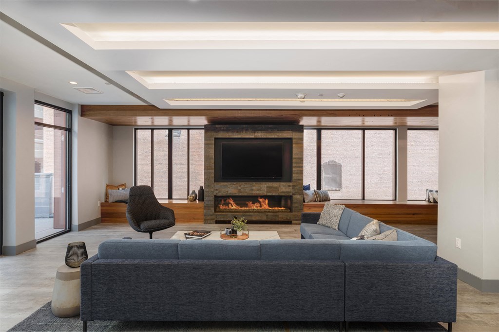 Resident club lounge with cozy fireplace at Nightingale, Providence, RI